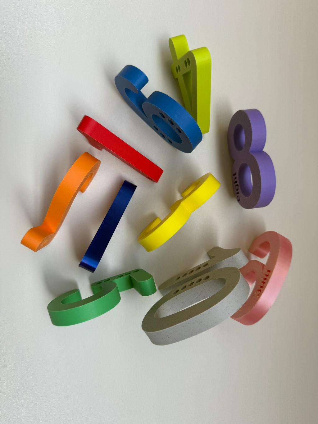 Colorful plastic bottle openers on a white background